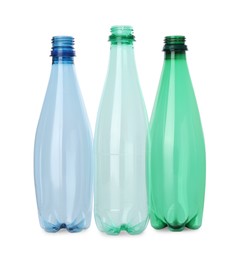 Photo of Many empty plastic bottles isolated on white