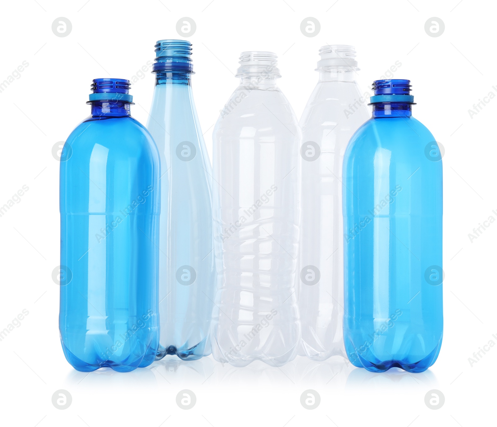 Photo of Many empty plastic bottles isolated on white