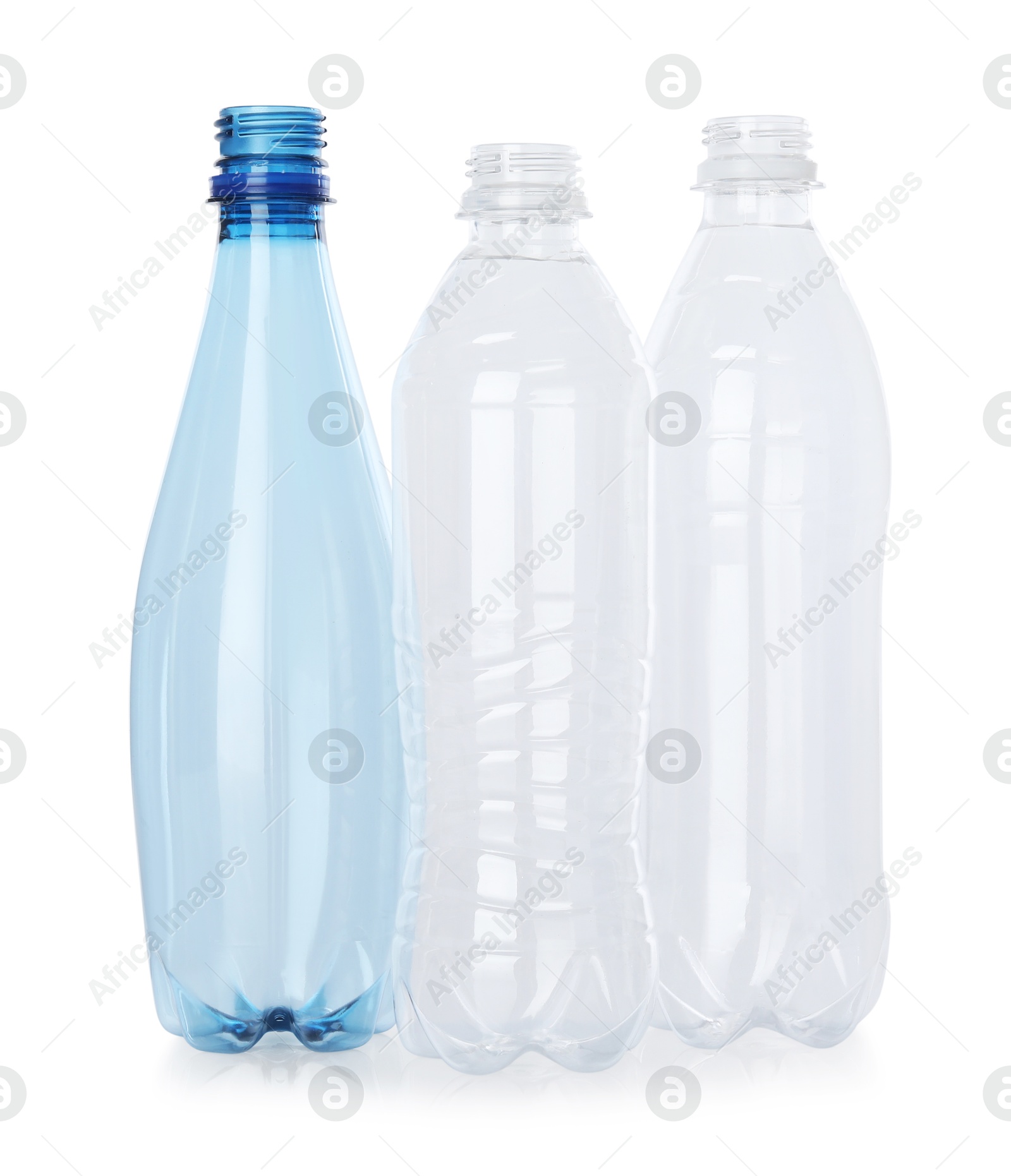 Photo of Many empty plastic bottles isolated on white