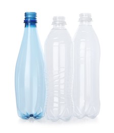 Photo of Many empty plastic bottles isolated on white