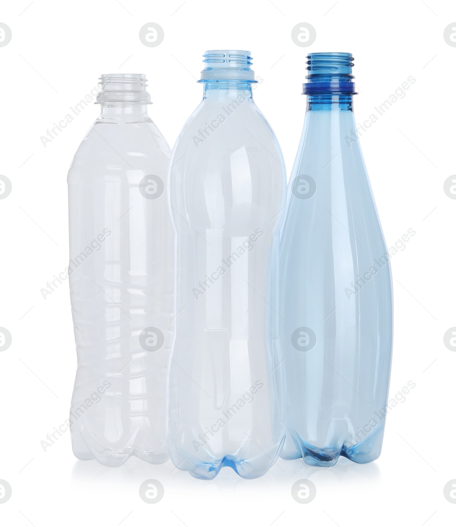 Photo of Many empty plastic bottles isolated on white