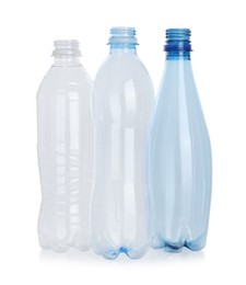 Photo of Many empty plastic bottles isolated on white