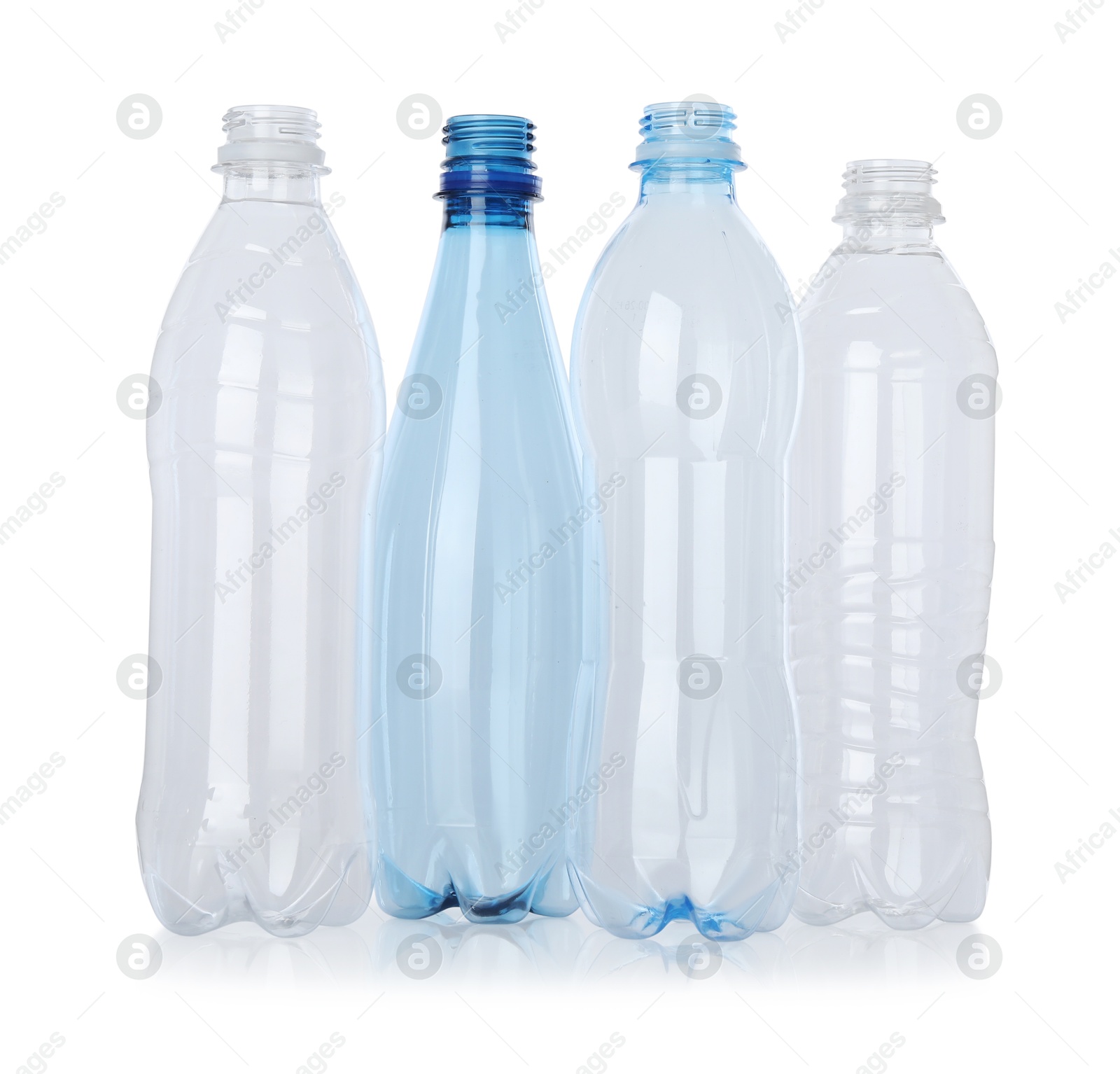 Photo of Many empty plastic bottles isolated on white