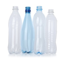 Photo of Many empty plastic bottles isolated on white