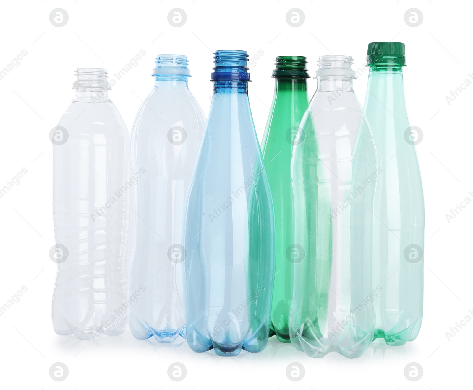 Photo of Many empty plastic bottles isolated on white