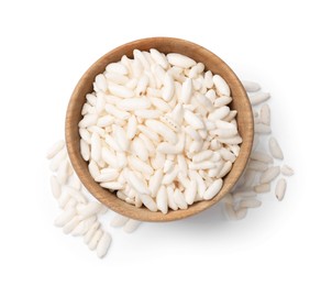 Photo of Puffed rice in wooden bowl isolated on white, top view