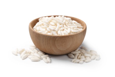 Photo of Puffed rice in wooden bowl isolated on white