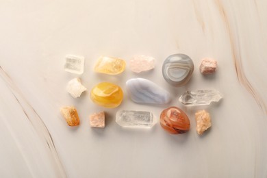 Photo of Beautiful natural gemstones on light background, flat lay