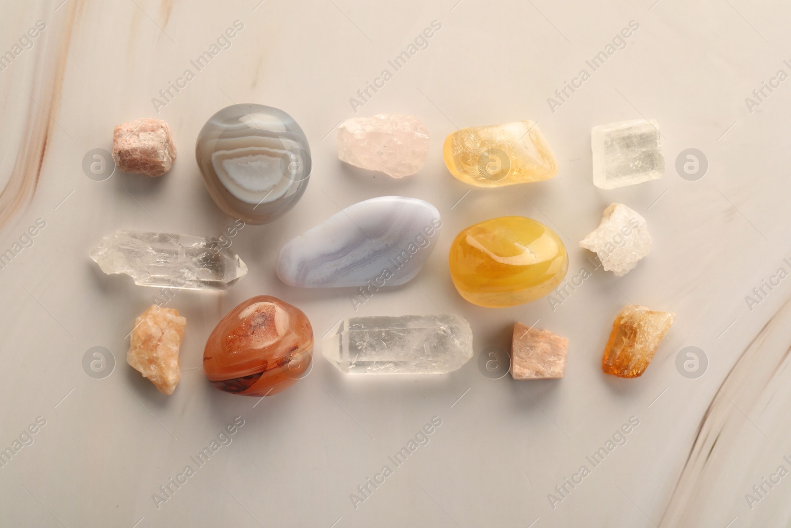 Photo of Beautiful natural gemstones on light background, flat lay