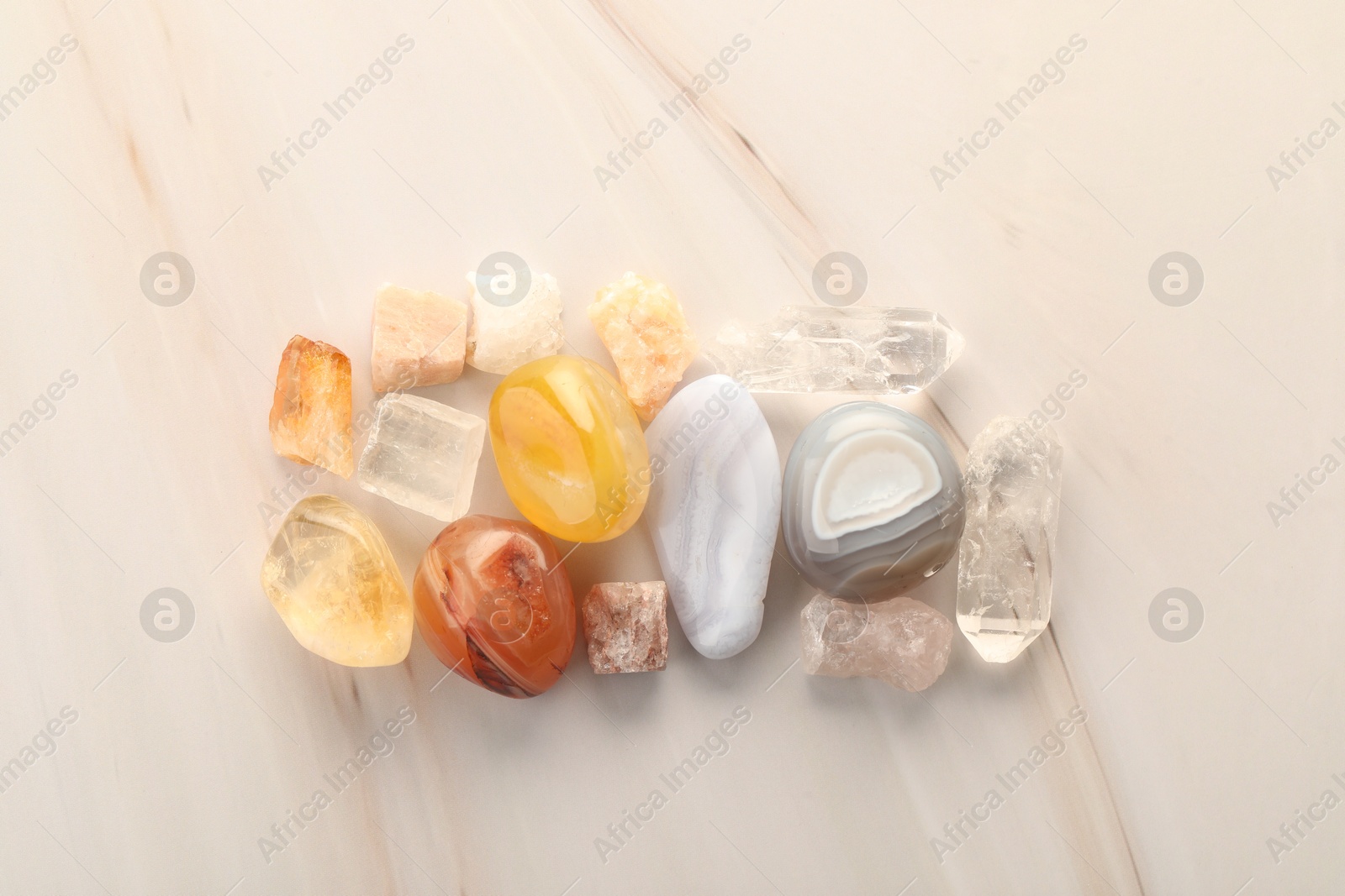 Photo of Beautiful natural gemstones on light background, flat lay