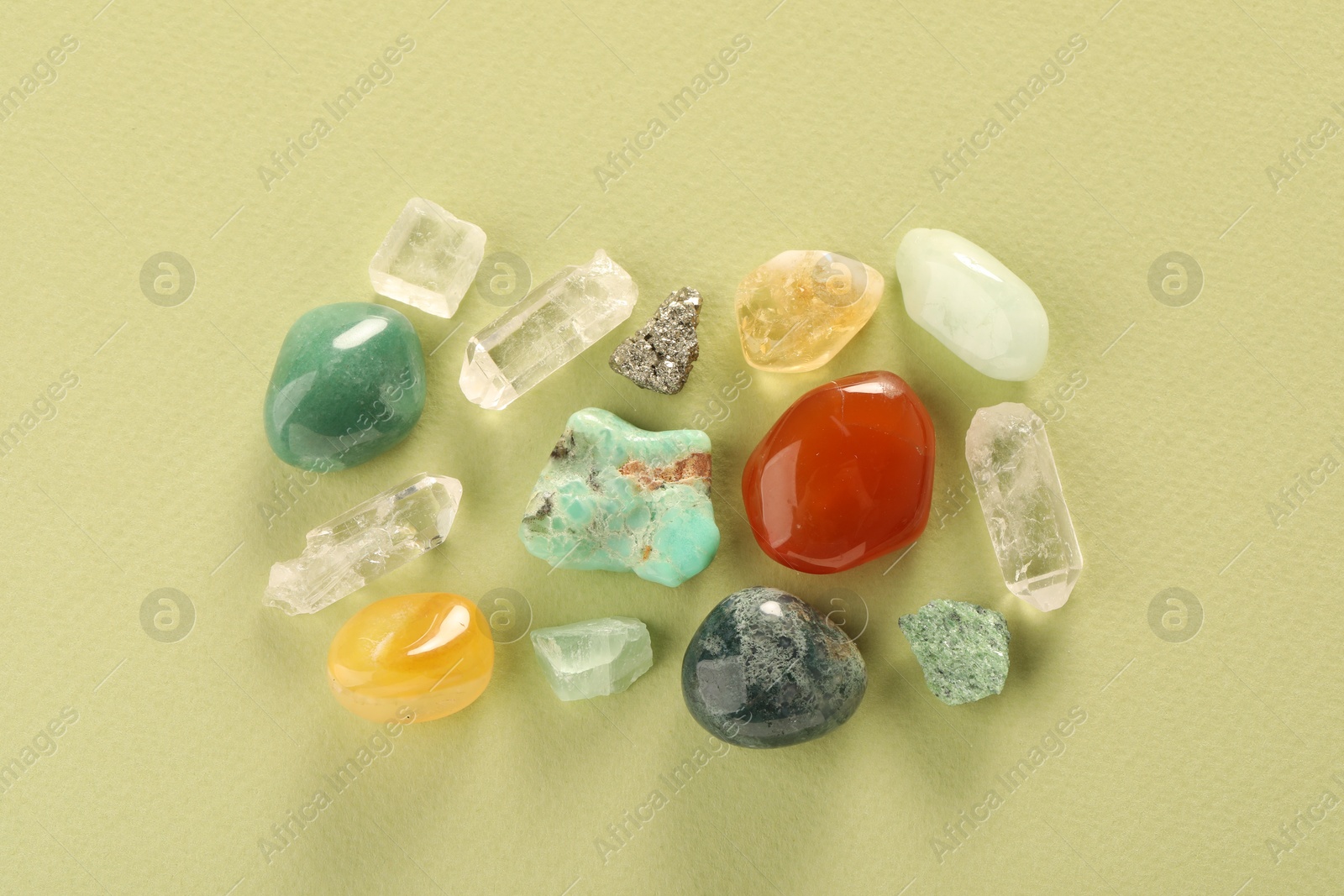 Photo of Beautiful natural gemstones on color background, flat lay