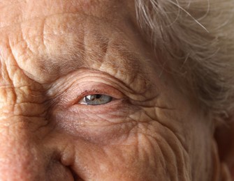 Photo of Senior woman with beautiful eyes, macro view