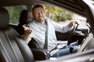 Photo of Man driving modern car, view through window