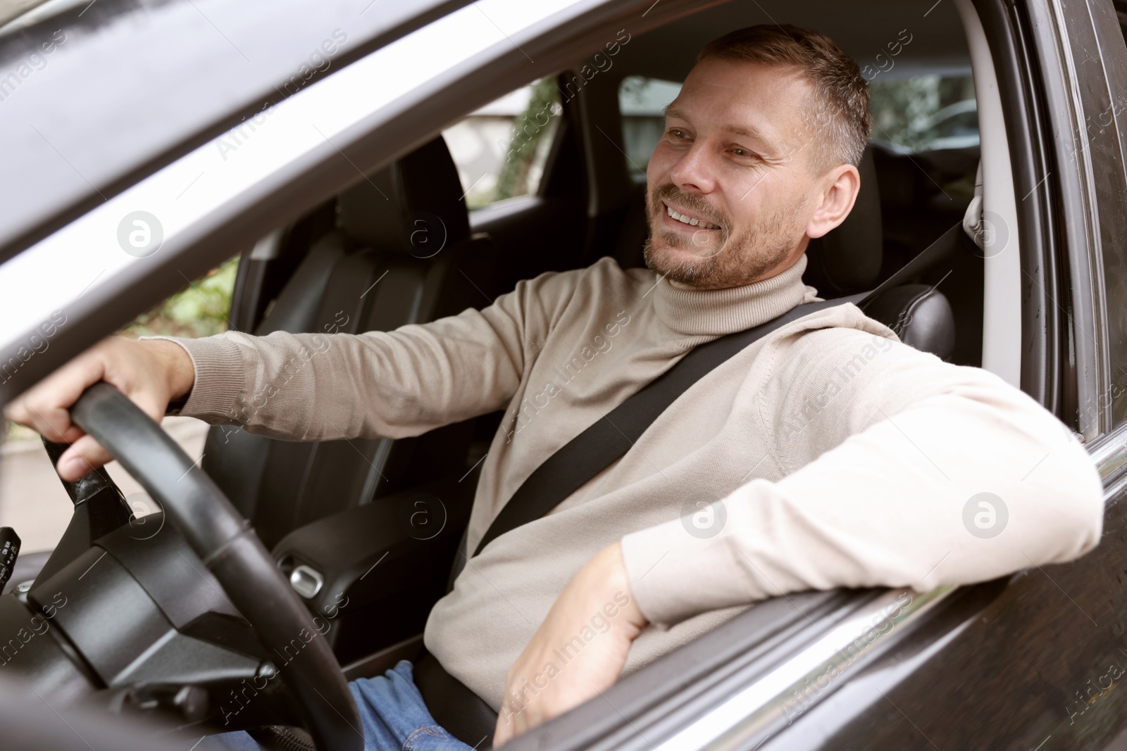 Photo of Man driving modern car, view through window