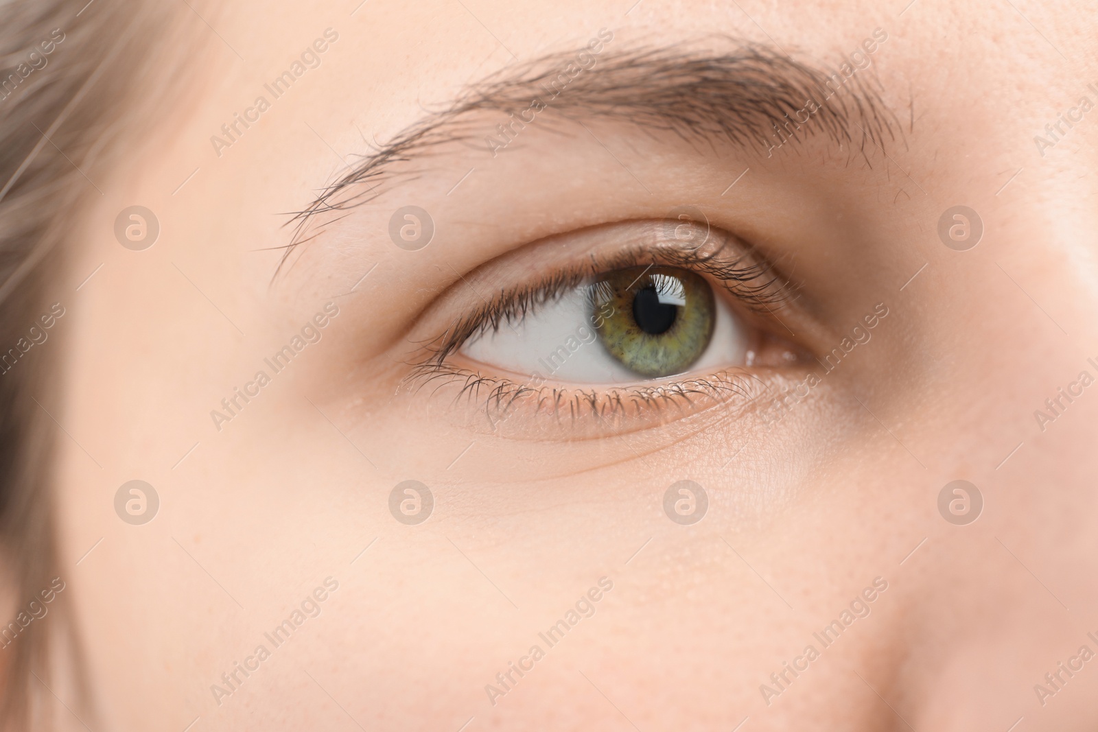 Photo of Closeup view of young woman with beautiful eyes