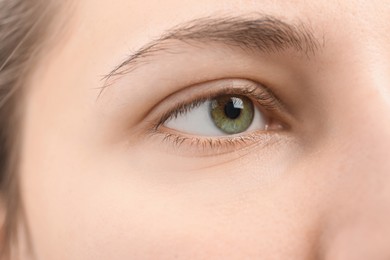 Photo of Closeup view of young woman with beautiful eyes