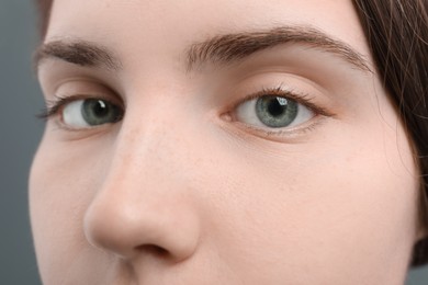 Photo of Closeup view of young woman with beautiful blue eyes