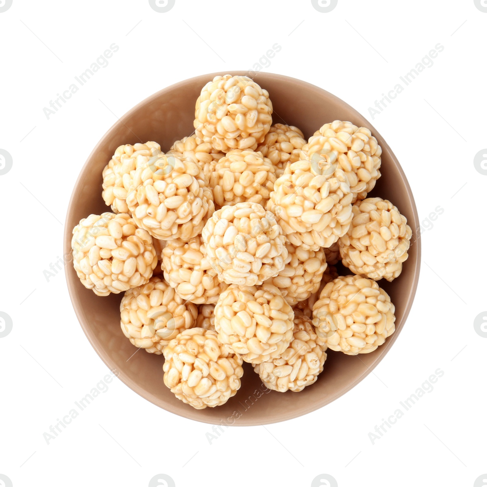 Photo of Delicious puffed rice balls in bowl isolated on white, top view