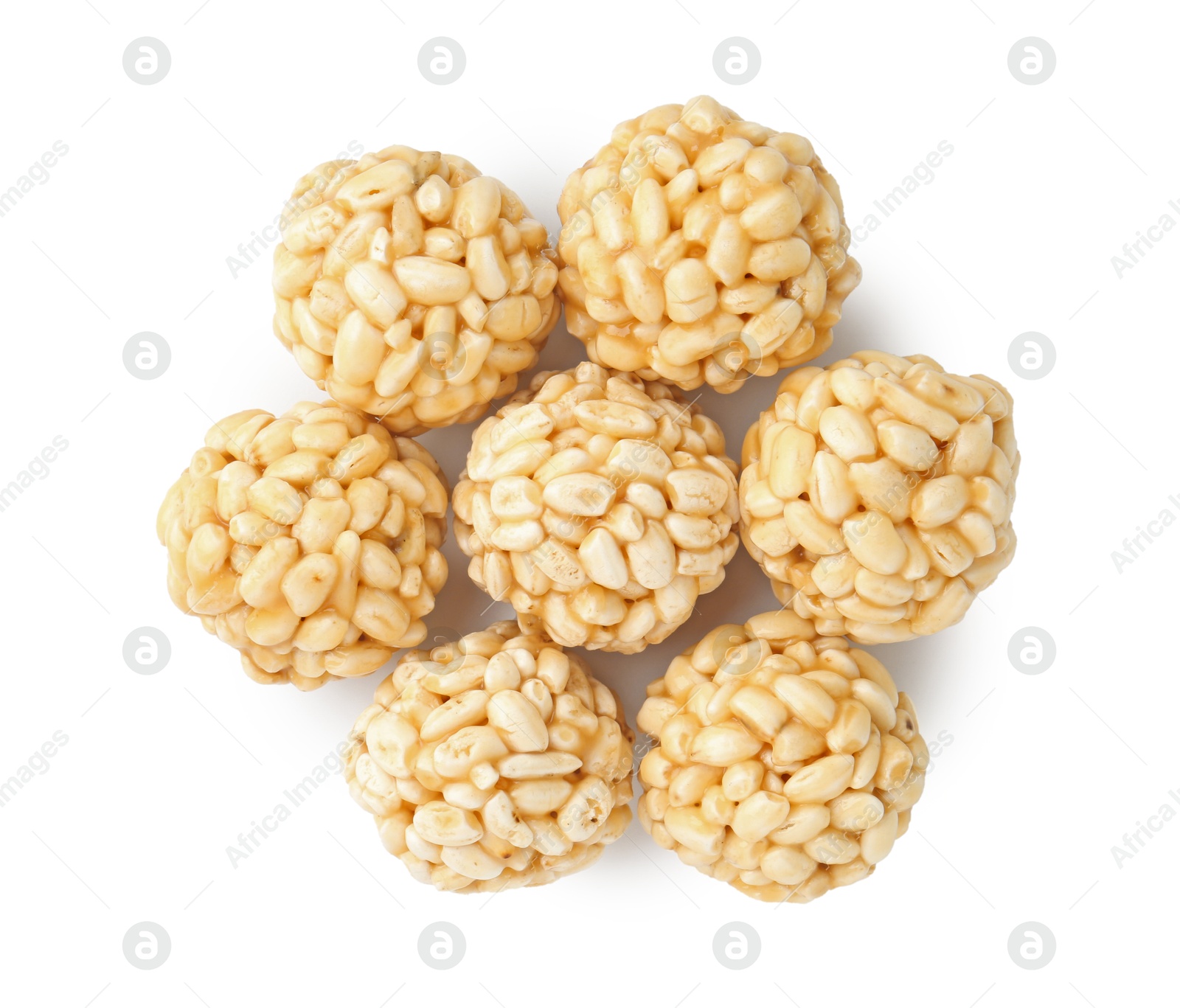 Photo of Delicious puffed rice balls isolated on white, top view