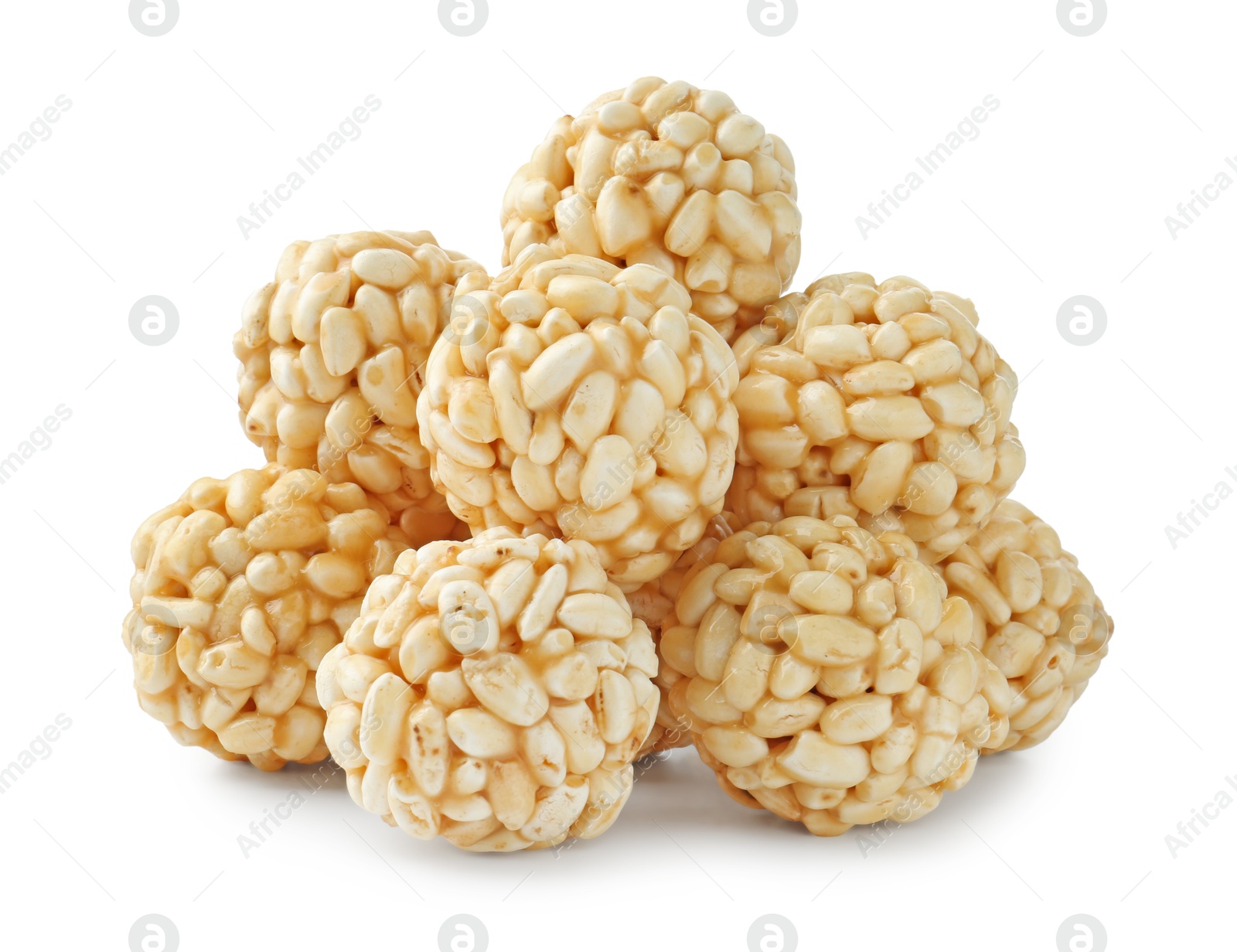 Photo of Delicious puffed rice balls isolated on white