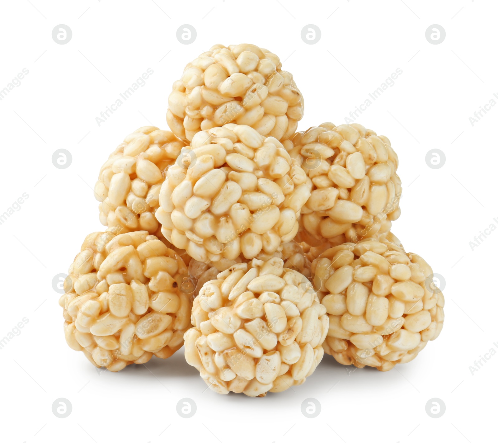 Photo of Delicious puffed rice balls isolated on white