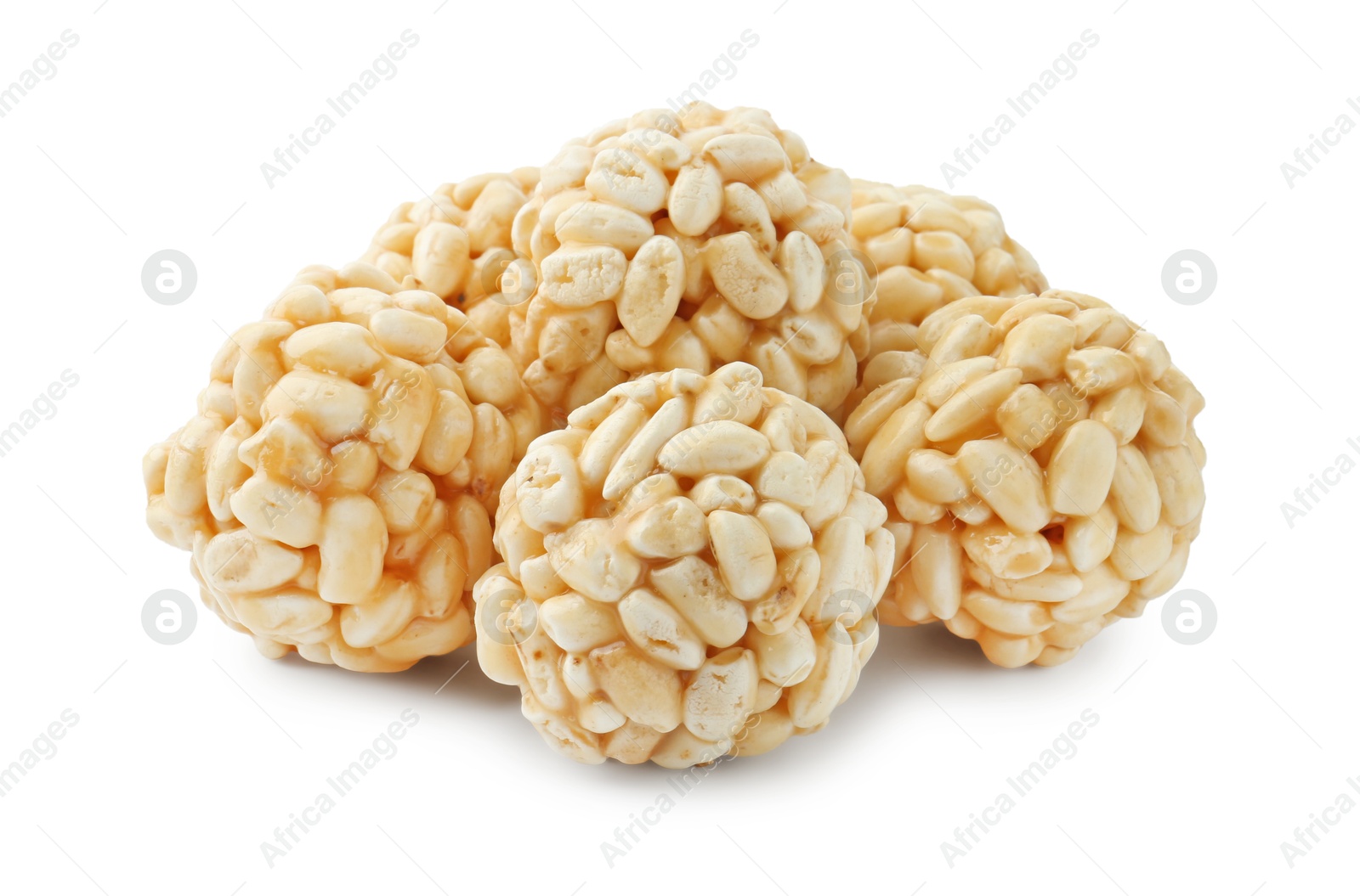 Photo of Delicious puffed rice balls isolated on white