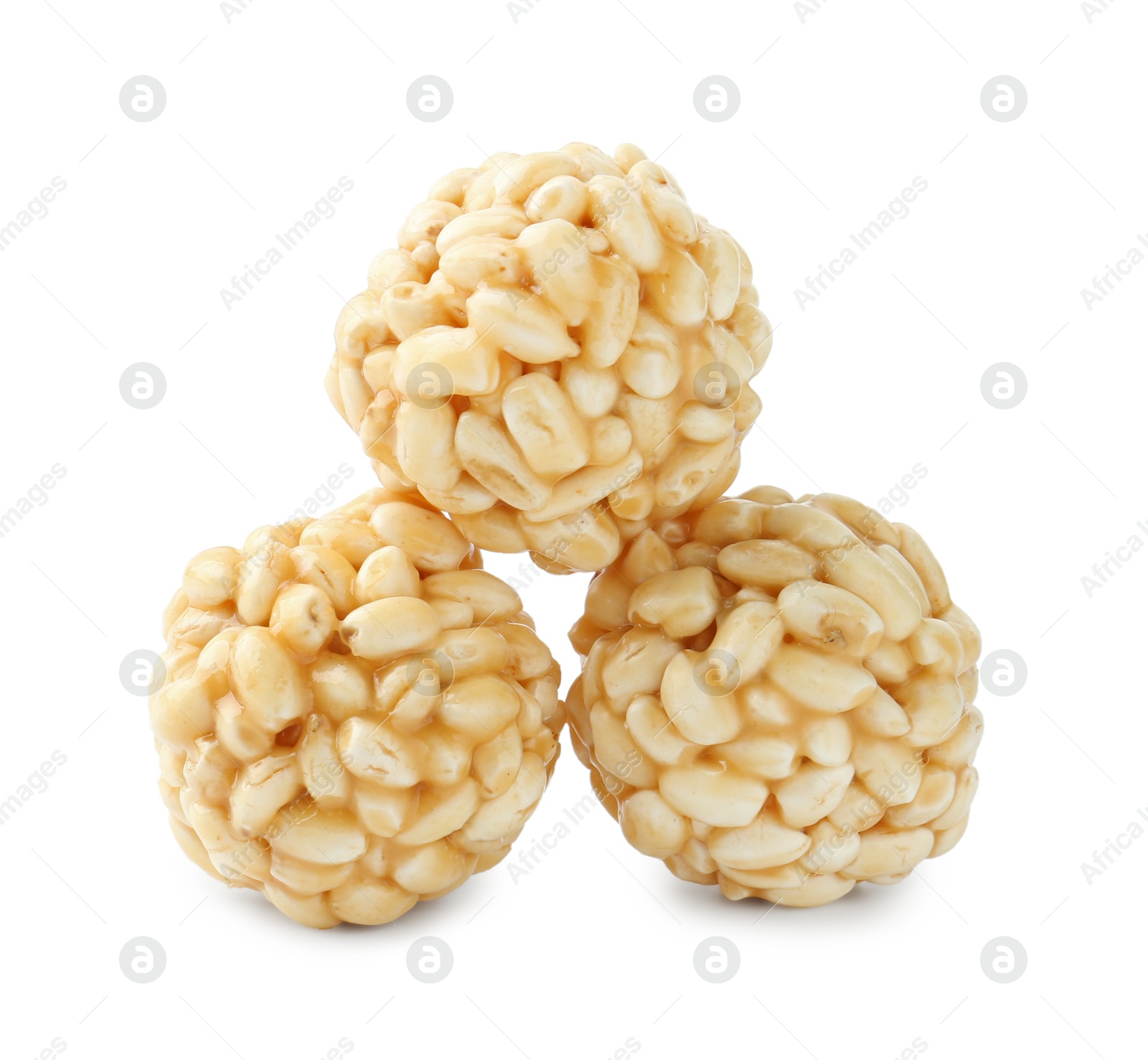 Photo of Delicious puffed rice balls isolated on white