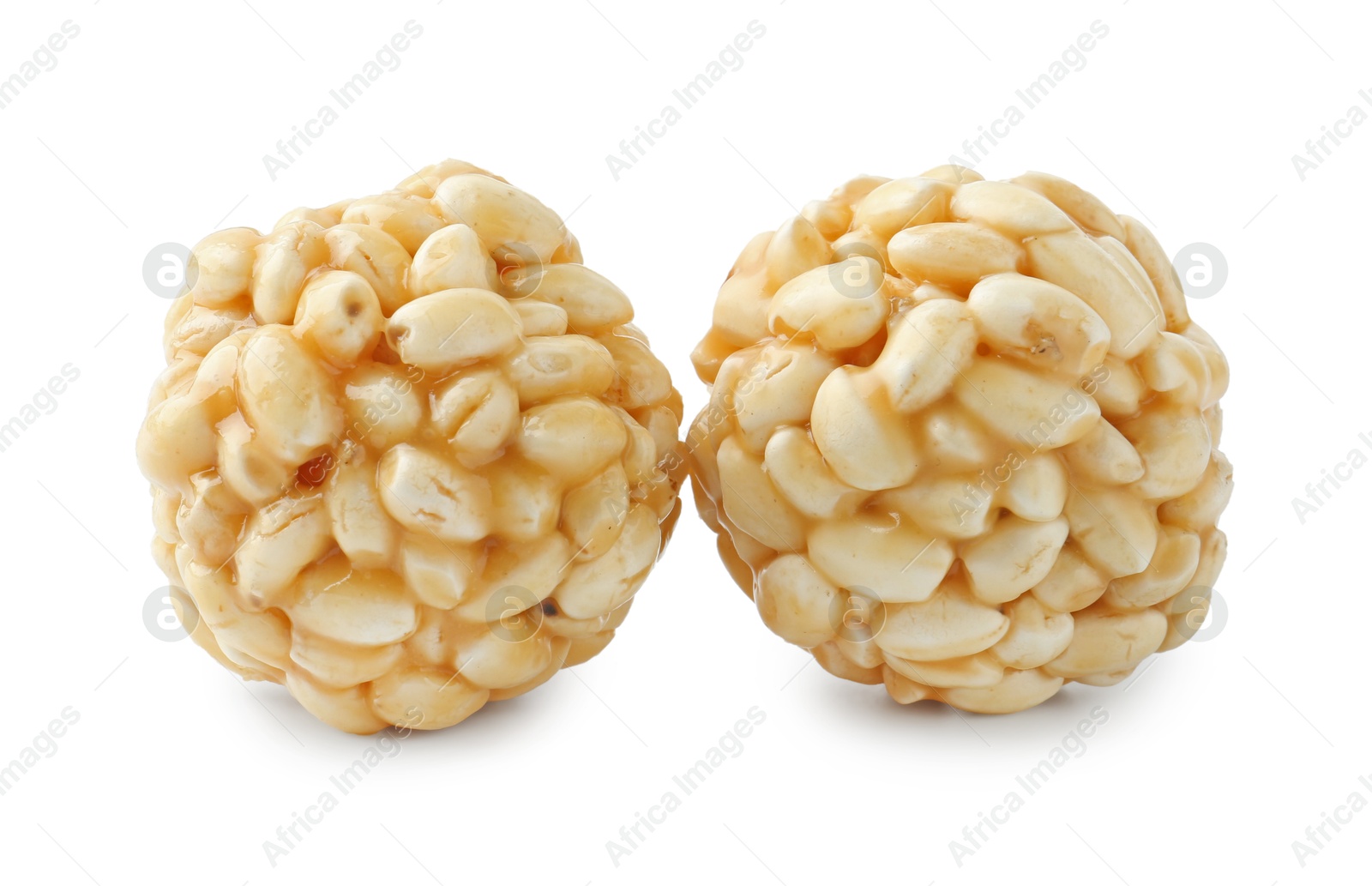 Photo of Delicious puffed rice balls isolated on white