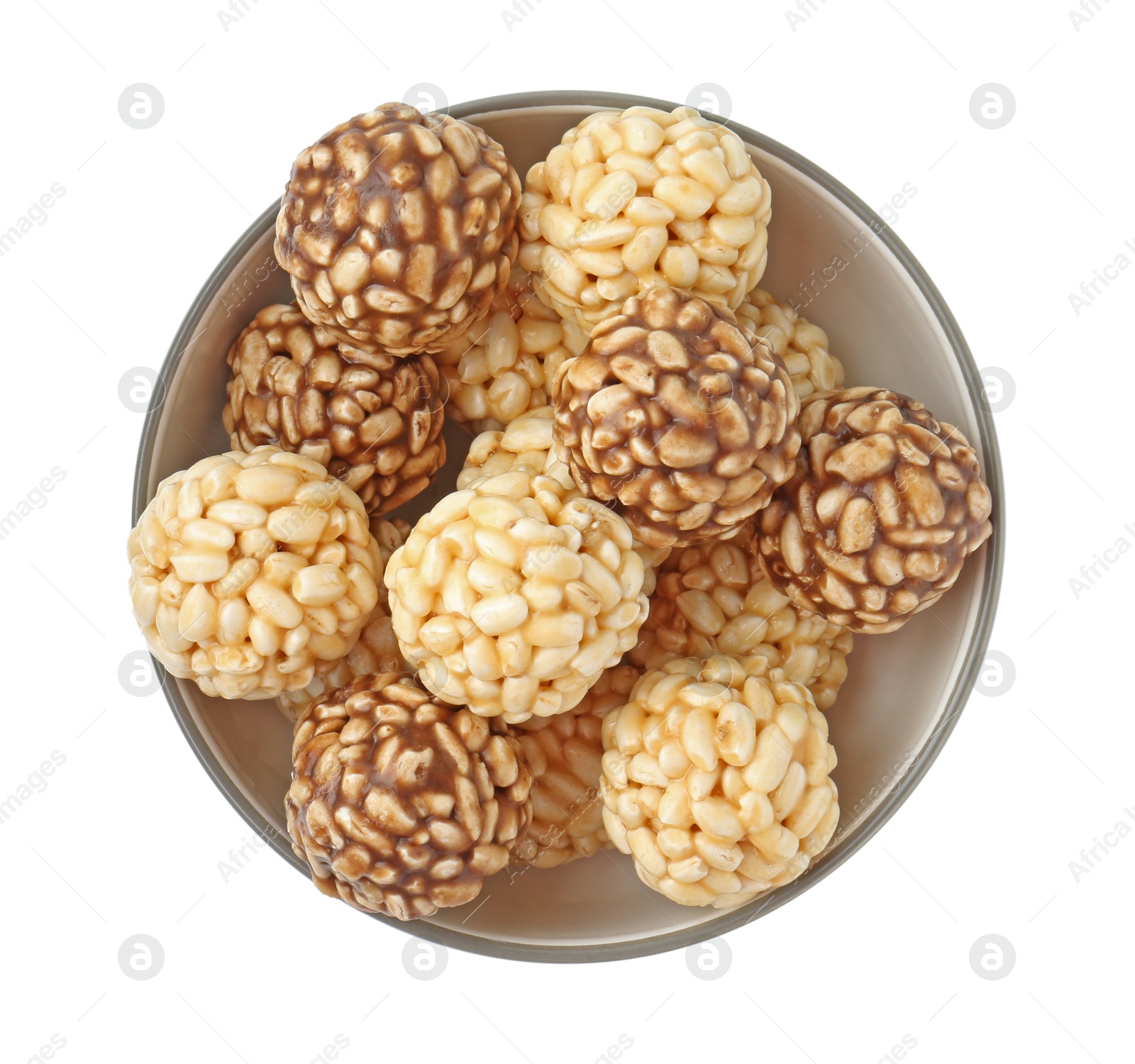 Photo of Tasty puffed rice balls in bowl isolated on white, top view