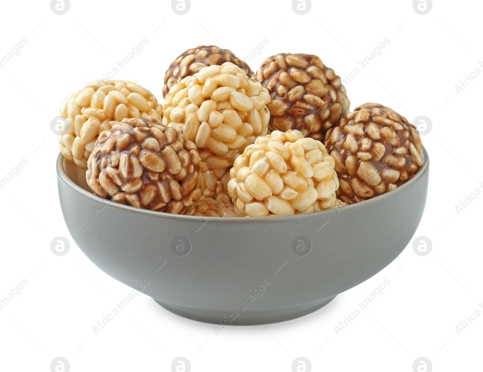 Photo of Tasty puffed rice balls in bowl isolated on white