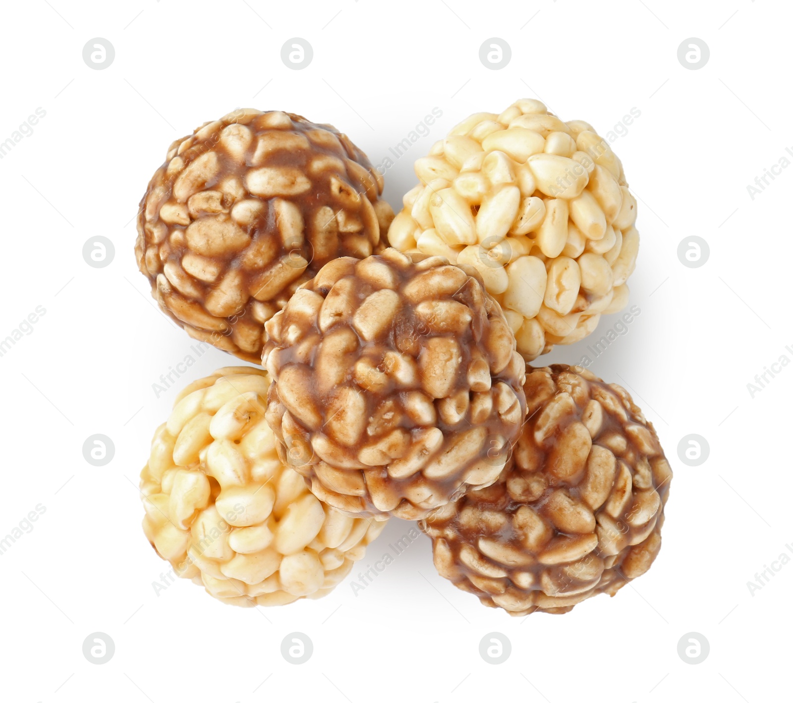 Photo of Tasty puffed rice balls isolated on white, top view