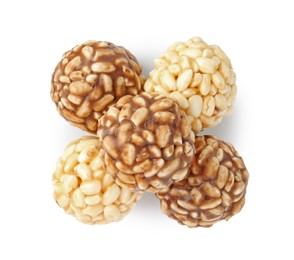 Photo of Tasty puffed rice balls isolated on white, top view