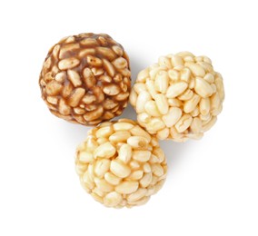 Photo of Tasty puffed rice balls isolated on white, top view