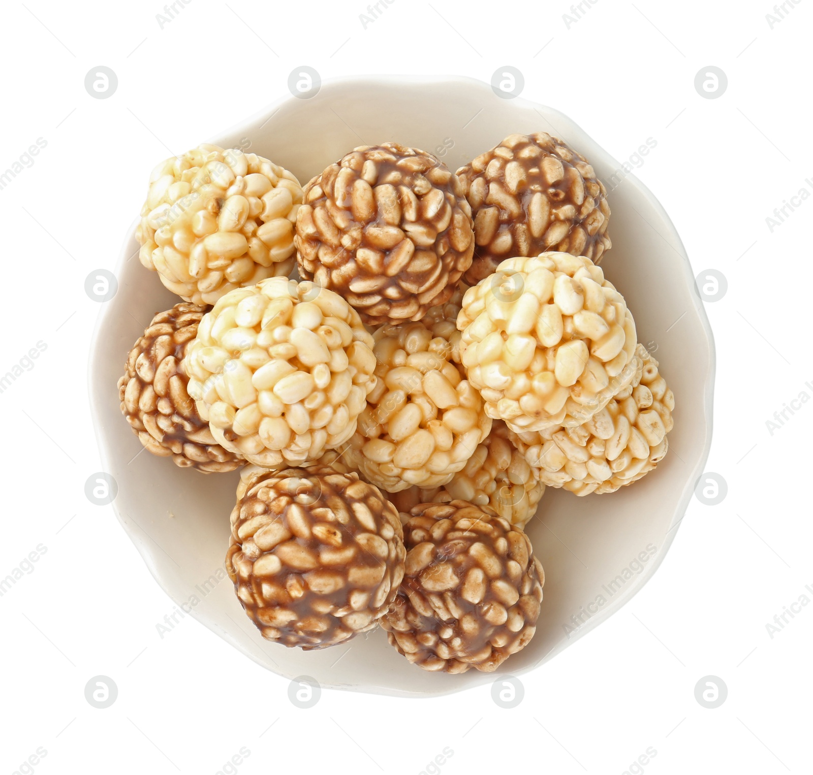 Photo of Tasty puffed rice balls in bowl isolated on white, top view