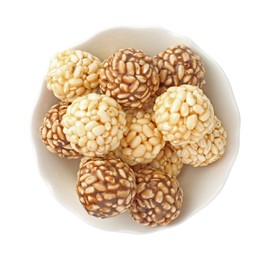 Photo of Tasty puffed rice balls in bowl isolated on white, top view