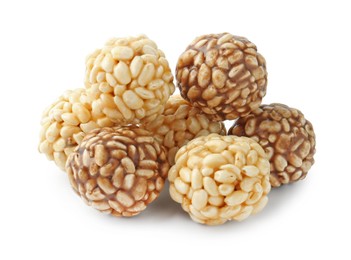 Photo of Tasty puffed rice balls isolated on white