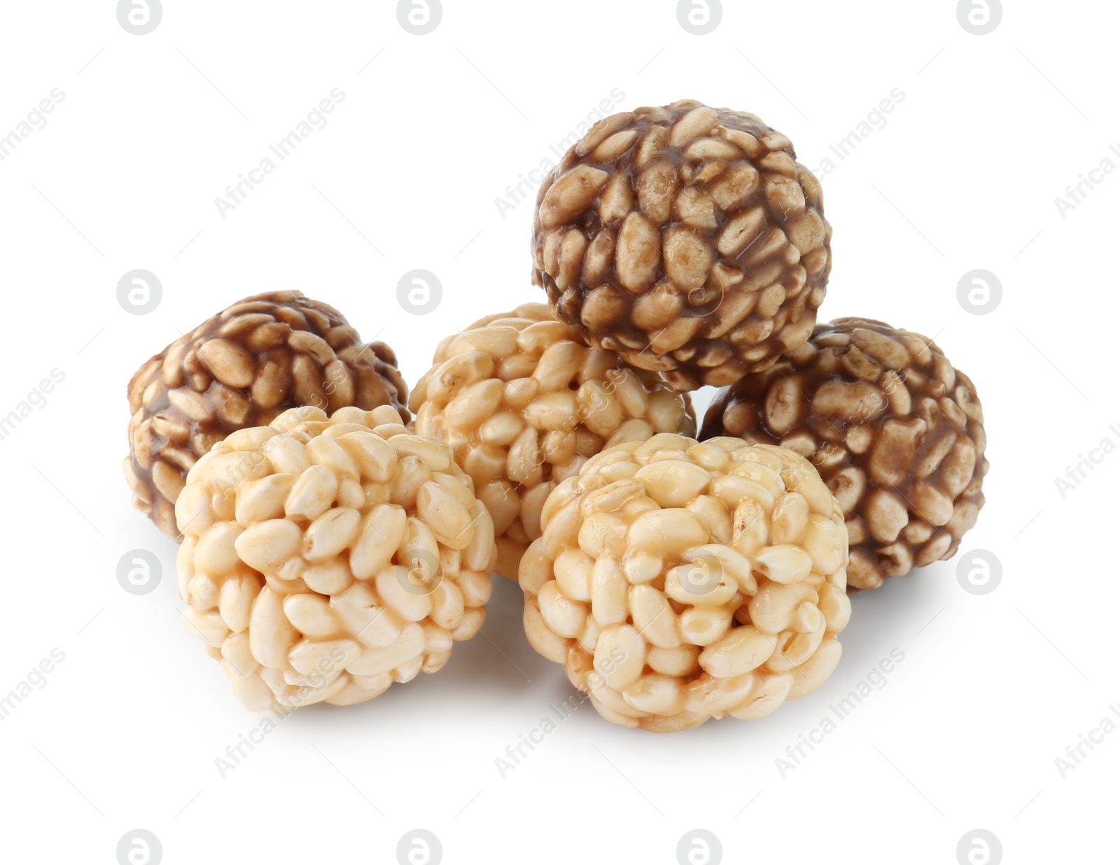 Photo of Tasty puffed rice balls isolated on white