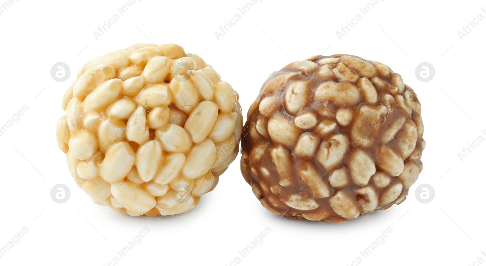 Photo of Tasty puffed rice balls isolated on white