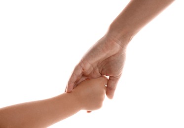 Mother and child holding hands on white background, closeup