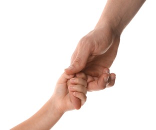 Father and child holding hands on white background, closeup