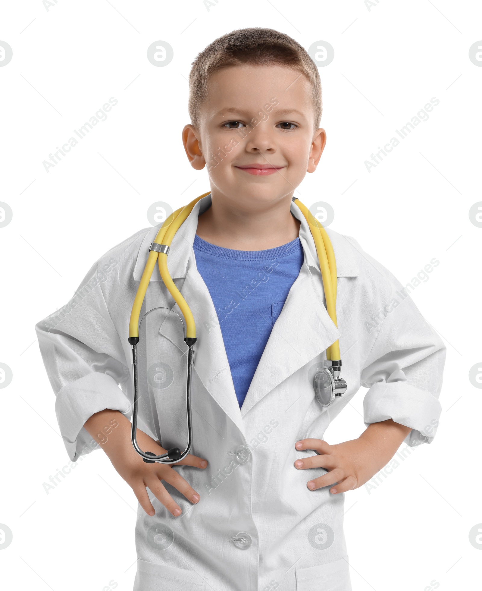 Photo of Little boy with stethoscope pretending to be doctor on white background. Dreaming of future profession