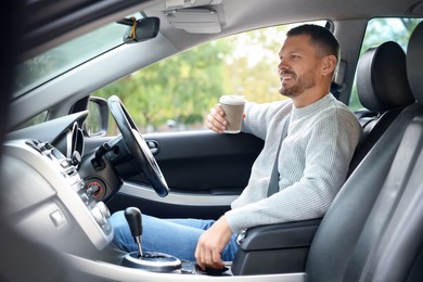 Photo of Man driving modern car, view through window