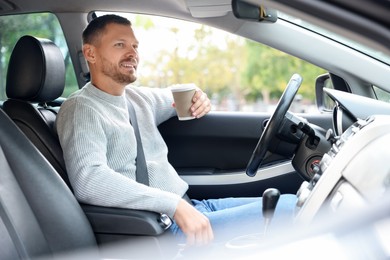 Photo of Man driving modern car, view through window