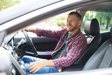 Photo of Man driving modern car, view through window