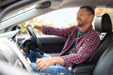 Photo of Man driving modern car, view through window