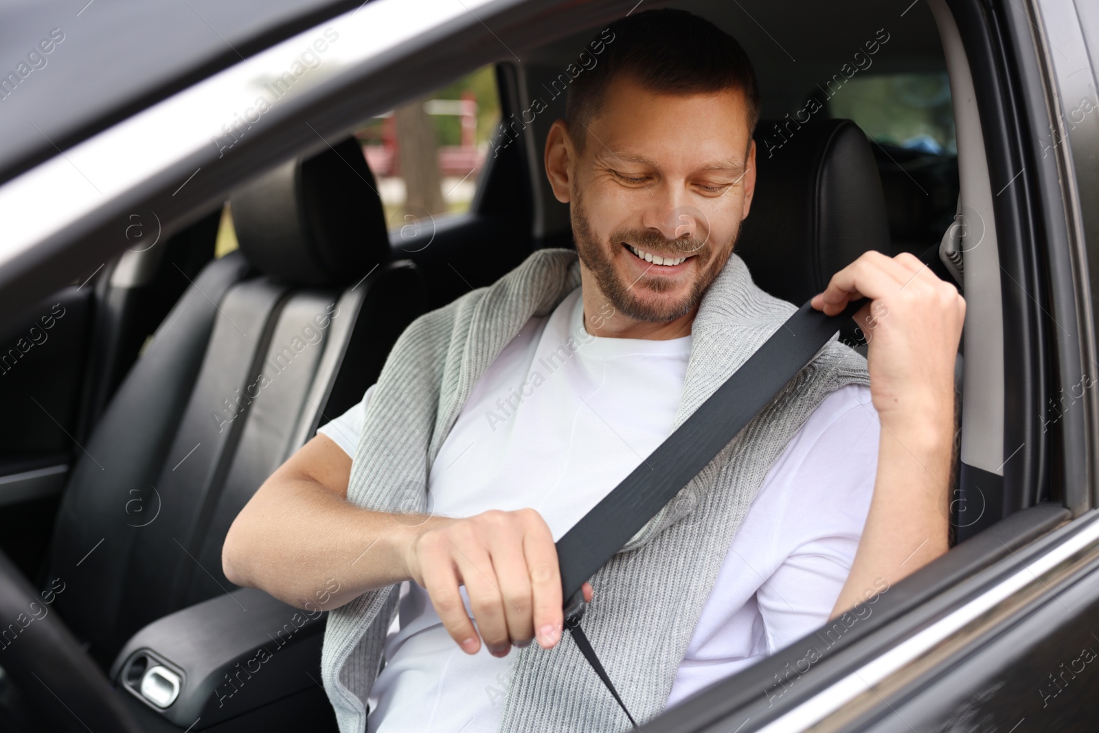 Photo of Man driving modern car, view through window