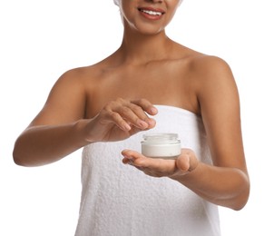 Photo of Young woman with jar of cream on white background, closeup