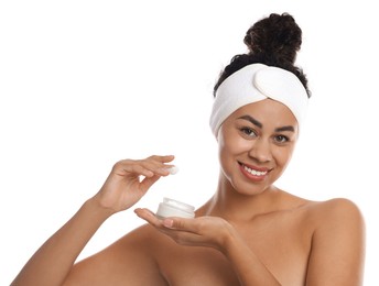 Photo of Young woman with jar of cream on white background