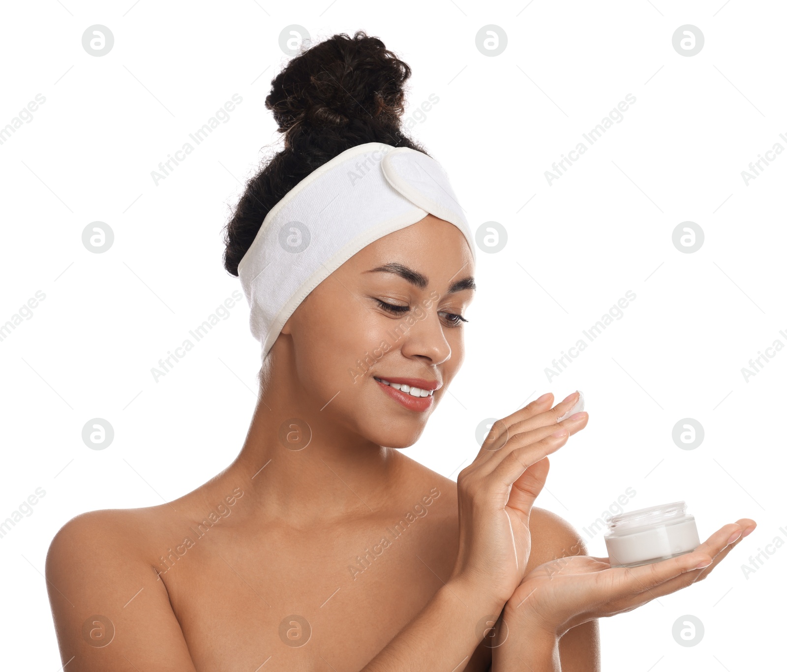 Photo of Young woman with jar of cream on white background