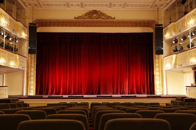 Photo of Theatre interior with stage and rows of comfortable seats